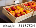 Red apples for sale in wooden nests 81137524