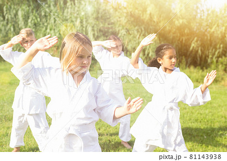 Barefoot kids doing kata Barefoot kids doing kata 81143938