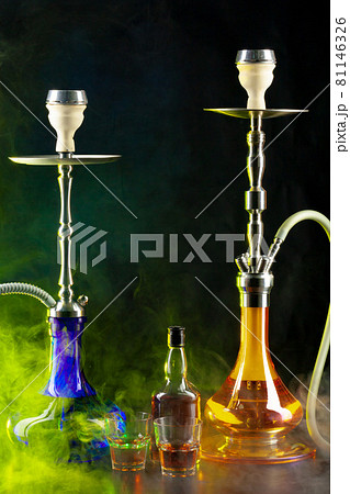Modern hookah with whiskey drink on black background 81146326