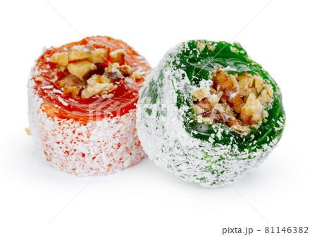 Colorful Turkish delight with nuts in powdered sugar isolated on white Colorful Turkish delight with nuts in powdered sugar isolated on white 81146382