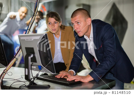People are solving puzzles on computer in escape room stylized laboratory People are solving puzzles on computer in escape room stylized laboratory 81148510
