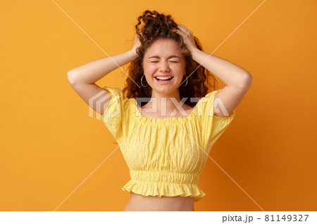 Concerned, stressed, regretful young woman holding her head Concerned, stressed, regretful young woman holding her head 81149327