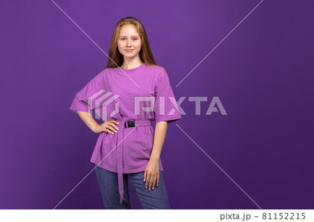 Half-length portrait of young beautiful girl isolated on purple studio background. Concept of human emotions, facial expression, youth, sales, ad. Half-length portrait of young beautiful girl isolated on purple studio background. Concept of human emotions, facial expression, youth, sales, ad. 81152215