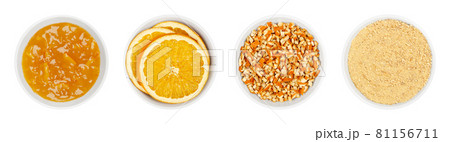 Orange jam and dried oranges, in white bowls. Marmalade, dried orange slices, chopped and powdered peel of oranges. Ingredients for Christmas cooking and decoration. Isolated, from above, over white. Orange jam and dried oranges, in white bowls. Marmalade, dried orange slices, chopped and powdered peel of oranges. Ingredients for Christmas cooking and decoration. Isolated, from above, over white. 81156711