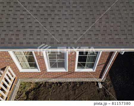 Shingles texture - close up view of asphalt roofing shingles Shingles texture - close up view of asphalt roofing shingles 81157380