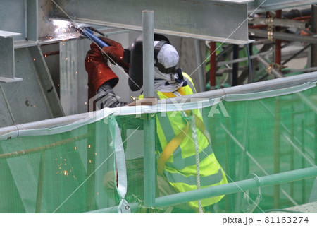 SELANGOR, MALAYSIA -SEPTEMBER 23, 2016: Welder wearing protective mask while welding metal at the construction site.  81163274