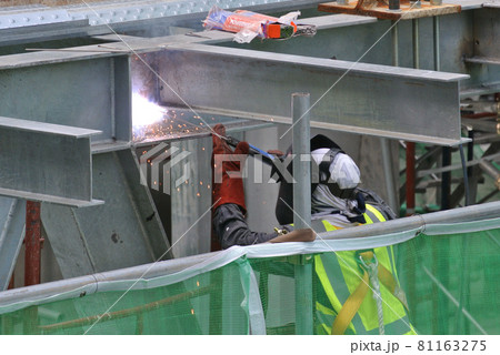 SELANGOR, MALAYSIA -SEPTEMBER 23, 2016: Welder wearing protective mask while welding metal at the construction site.  81163275