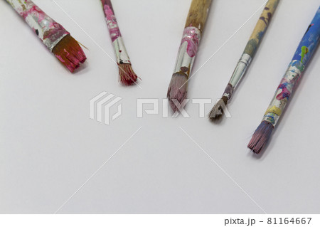 dirty art paint brusches of different sizes and colors on white background, copy space dirty art paint brusches of different sizes and colors on white background, copy space 81164667