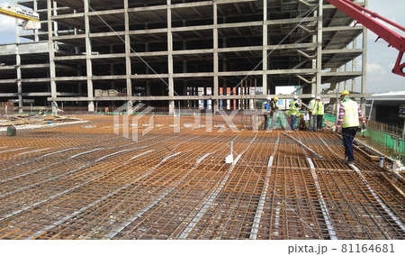 SELANGOR, MALAYSIA -MAY 13, 2016: Floor slab reinforcement bar at the construction site. It use to strengthen the concrete. It is shaped follow the engineer design. SELANGOR, MALAYSIA -MAY 13, 2016: Floor slab reinforcement bar at the construction site. It use to strengthen the concrete. It is shaped follow the engineer design. 81164681