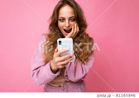 Photo of attractive crazy amazed surprised young woman wearing casual stylish clothes standing 81165846