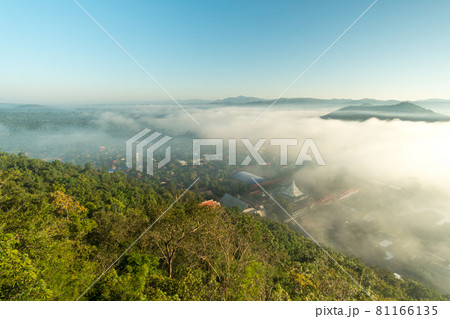 Morning fog covers Lamphun, Thailand, view from the viewpoint of Wat Phra That Pha Temple 81166135