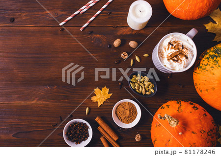 Traditional autumn drink pumpkin spice latte among seasonings of cinnamon 81178246