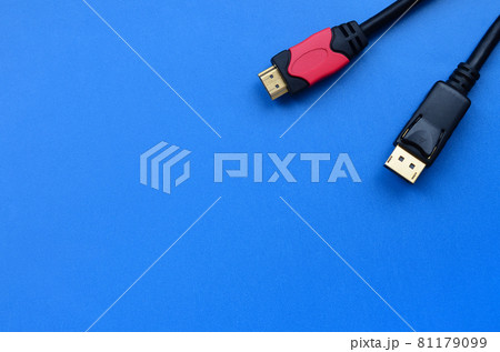 Audio video HDMI computer cable plug and 20-pin male DisplayPort gold plated connector for a flawless connection on a blue background Audio video HDMI computer cable plug and 20-pin male DisplayPort gold plated connector for a flawless connection on a blue background 81179099
