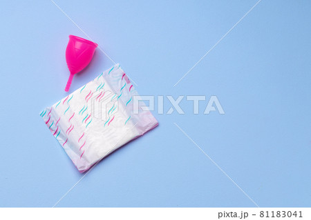 Menstrual cup and hygienic pad on paper background Menstrual cup and hygienic pad on paper background 81183041