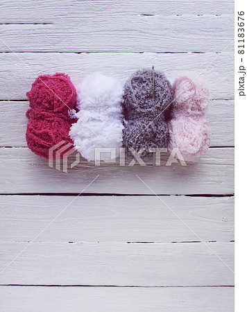 Colorful yarn on wooden background. 81183676