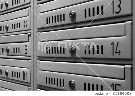 View of mailboxes in an apartment building. View of mailboxes in an apartment building. 81184008