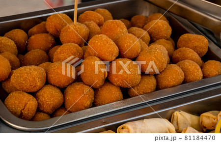 many Ascoli olives in a metal container many Ascoli olives in a metal container 81184470