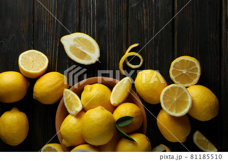 Ripe lemons on wooden background, top view Ripe lemons on wooden background, top view 81185510