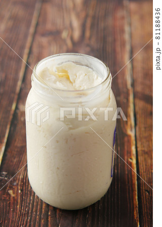 close up of Mayonnaise in container on table . 81188436