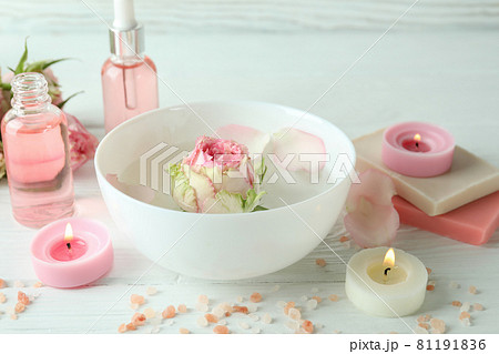 Skin care concept with essential rose oil on white wooden table Skin care concept with essential rose oil on white wooden table 81191836