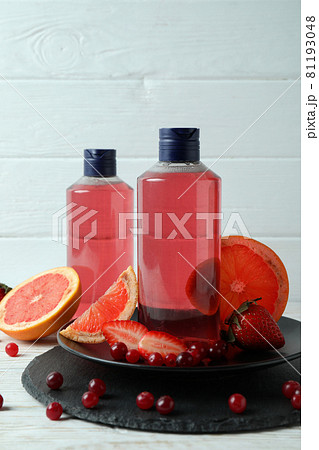 Natural shower gel and ingredients against white wooden background 81193048