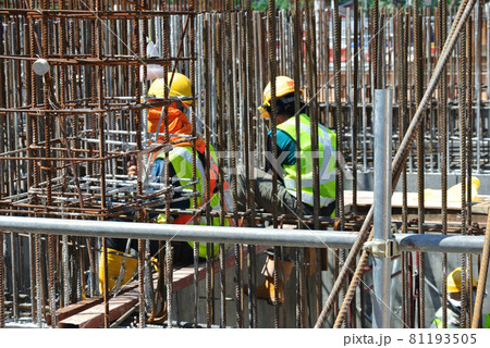 SELANGOR, MALAYSIA -JUNE 15, 2016: Hot rolled deformed steel bars or steel reinforcement bar at construction site. It use to strengthen concrete. Cover by timber form work. SELANGOR, MALAYSIA -JUNE 15, 2016: Hot rolled deformed steel bars or steel reinforcement bar at construction site. It use to strengthen concrete. Cover by timber form work. 81193505