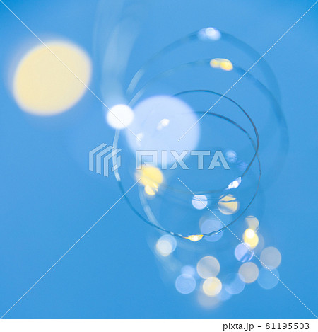 Texture of New Year or Christmas garland on a blue background. Abstract painting 81195503