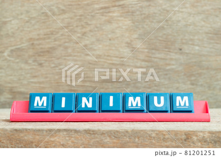 Tile alphabet letter with word minimum in red color rack on wood background Tile alphabet letter with word minimum in red color rack on wood background 81201251