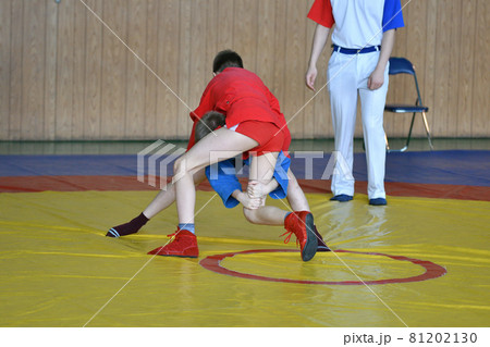 Two boys compete on the wrestling mat 81202130