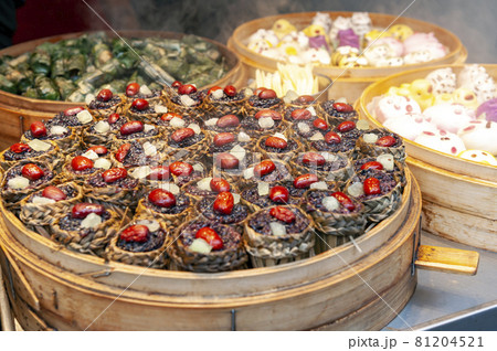 Local street food and snacks sold at the Qibao Old Street in Qibao Ancient Town, a historic water township of Qibao in the Minhang District of Shanghai, China 81204521