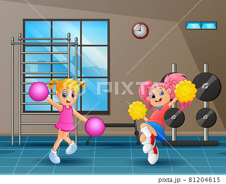 Two cute girls practicing cheerleading in gym Two cute girls practicing cheerleading in gym 81204615