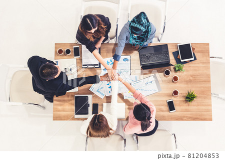 Teamwork business people join hands in meeting. Teamwork business people join hands in meeting. 81204853