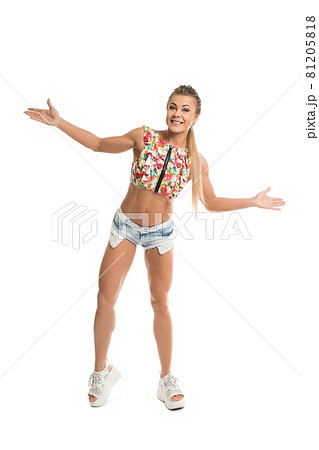 Cheerful young woman in summer outfit in studio Cheerful young woman in summer outfit in studio 81205818