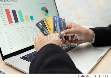Asian accountant working, calculate and analyzing report project accounting with notebook and credit card in modern office, finance and business concept. Asian accountant working, calculate and analyzing report project accounting with notebook and credit card in modern office, finance and business concept. 81210741