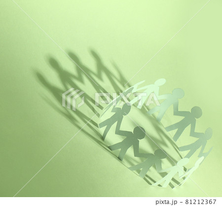 Team of paper doll people holding hands 81212367