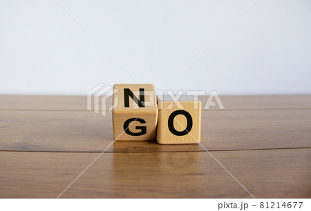 Fliped cube, changes the word NO to GO. Beautiful white background. Copy space. Fliped cube, changes the word NO to GO. Beautiful white background. Copy space. 81214677