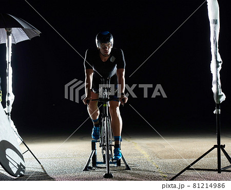 triathlon athlete portrait while resting on bike training 81214986