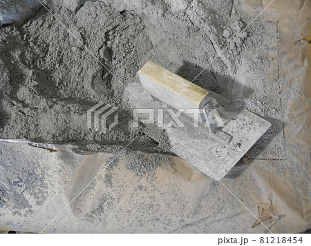 JASIN, MALAYSIA -SEPTEMBER 07, 2016: Cement bag and cement trowel at the construction site.  81218454