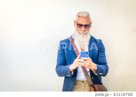 Senior man with a phone 81218788