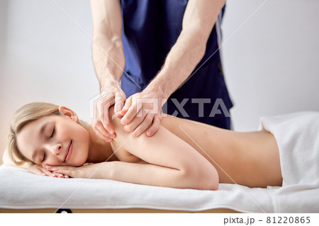 Cropped Photo Of Male Masseur Therapist In Cosmetology Room Doing Massage To Female Cropped Photo Of Male Masseur Therapist In Cosmetology Room Doing Massage To Female 81220865