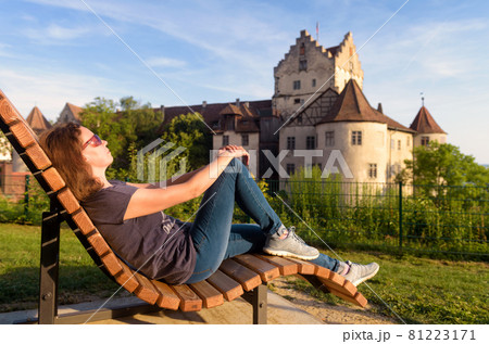 Young woman rests at Meersburg Castle, Germany Young woman rests at Meersburg Castle, Germany 81223171
