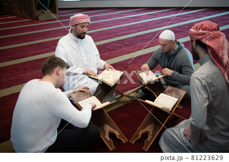 muslim people in mosque reading quran together muslim people in mosque reading quran together 81223629