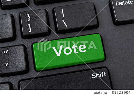 Vote green key on a black pc keyboard. Online participation in elections, internet voting. 81223904