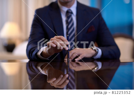 corporate businessman at luxury office pen holding corporate businessman at luxury office pen holding 81225352