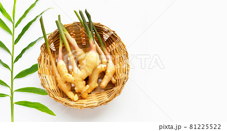 Young ginger in bamboo basket on white background. 81225522