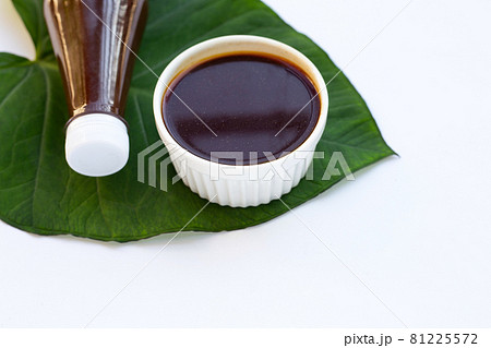 Strong pickled fish sauce on taro leaf 81225572