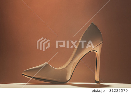 Women high heeled shoe standing on podium 81225579