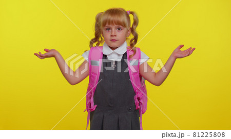 Confused schoolgirl feeling embarrassed about ambiguous question, having doubts, no idea, clueless 81225808