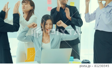 Business people celebrate success of proficiently finished project Business people celebrate success of proficiently finished project 81230345