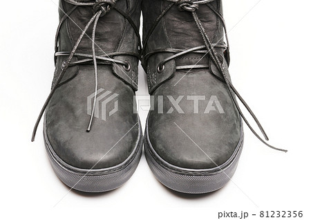 Toes of black boot shoes 81232356